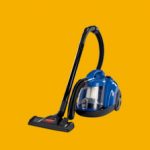 A blue and black vacuum cleaner on a yellow background.